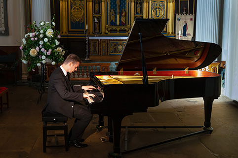 Daniel Lebhardt playing the Kawai grand piano in St Chad's Church Shrewsbury