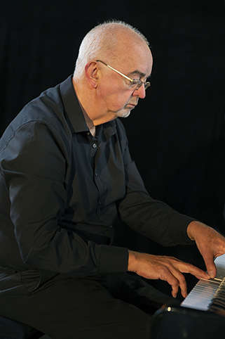 Martin playing the Kawai baby grand